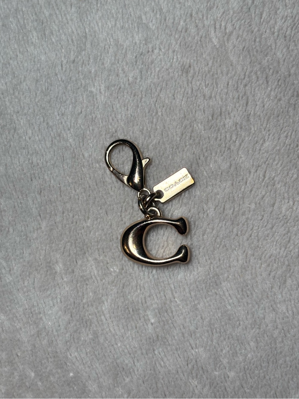Coach C charm gold tone